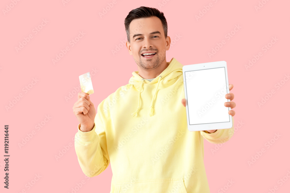 Poster man with credit card and tablet computer on pink background. mockup for design