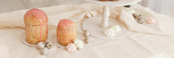 A set table for the celebration of Easter. Cakes and quail eggs on the Easter table.