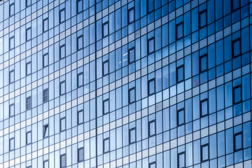 Office building glass windows facade in perspective. Business office center business activity center