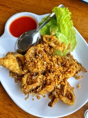 Crispy fried river fish in Thailand. Fried fish refers to any fish or shellfish that has been prepared by frying. Often, the fish is covered in batter, or flour, or herbs and spices before being fried