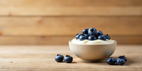 Creamy Yogurt with a Bountiful Topping of Sweet Blueberries Served in a Rustic Bowl on a Wooden Surface
