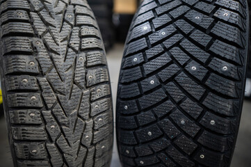 Comparison of old and new studded car tires. 