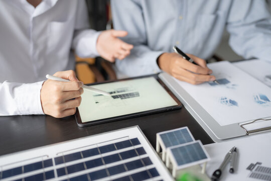 Solar panels green energy Business man working green eco friendly office business creative idea Planing Bio economy for business eco friendly professional Engineer sustainable electricity.