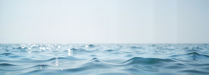 Calm blue sea with gentle waves and reflections