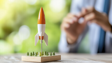 Rocket model on wooden base symbolizes innovation and ambition in business
