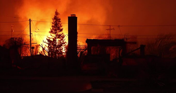 Altadena, California, USA - January 8, 2025: Powered by extreme Santa Ana winds, the Eaton Fire tears through a domestic neighborhood.