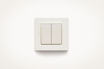 Cream colored wall mounted cream colored double light switch