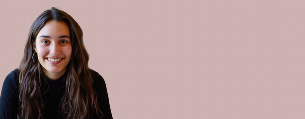 Portrait of a smiling woman with long hair against a light pink background, providing ample copy space for text or designs, perfect for promotional materials