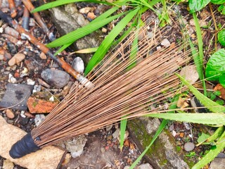 broom made from coconut leaf bones for cleaning the yard