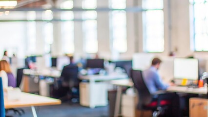 An open-plan office space with a soft-focus background, highlighting the spacious layout.
