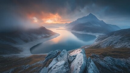 Serene Mountain Landscape with Calm Water and Dramatic Clouds