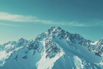 Obraz premium A stunning view of snow-capped mountains under a clear blue sky.