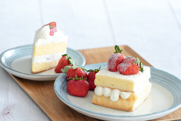 Japanese shortcake with strawberries on top is placed on a white wooden floor