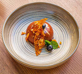 chocolate pastry with caramel and blueberries