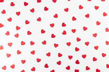 Top view of red hearts on white background. Valentine's day, red hearts, love wallpaper. Flat lay, copy space.