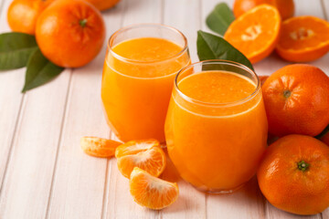 Tasty tangerine juice and fresh ripe fruits