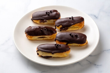 Traditional french eclairs with chocolate.