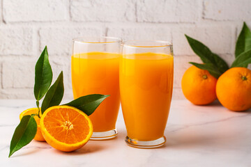 Orange tangerine fruits and glass of fresh tangerine juice