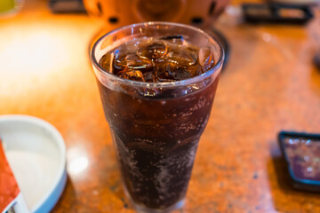 Refreshing Glass of Iced Cola on a Warm Day, Perfect for Quenching Thirst and Enjoying a Cool Beverage