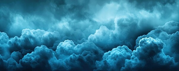 Naklejka premium Cloudy abstract background idea. Dramatic blue clouds in a moody atmosphere creating a serene and calming effect.
