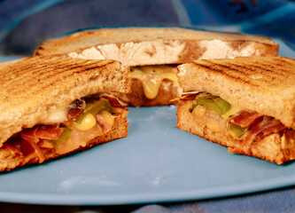 Homemade sandwich with cheese, ham and cucumber