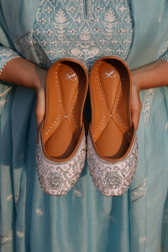 MUMBAI, INDIA &ndash; JANUARY 8, 2025: Juti or Jutti, traditional national shoes, sandals, flats, footwear from North India, Pakistan. Folk handicraft, craft. Folk clothes. Pakistani, Indian shoes. Ornament