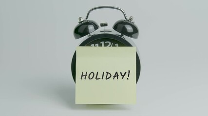 Holiday Text or Word on Yellow Note Paper Sticking onto Black Alarm Clock on White Background With Sound