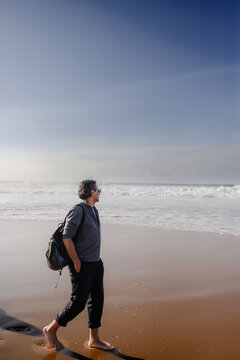 Man Enjoying Scenic Ocean View at Praia da Adraga