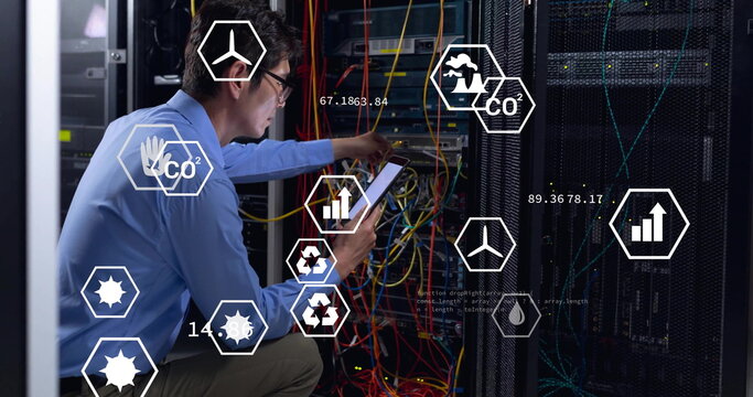 Image of eco icons and digital data processing over asian male it engineer by computer servers
