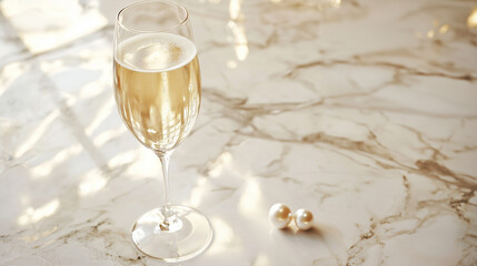 A flute of champagne rests on a smooth marble surface, with a single pearl or diamond nestled within the bubbles. The image evokes a luxurious and decadent atmosphere