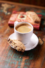 Cup of coffee and Cantuccini (Italian cookie) on dark wooden background. Copy space.