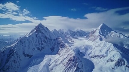 Obraz premium Majestic snow-covered peaks reach for the sky. The beauty of nature captivates and inspires awe. The rugged landscape is a testament to the power of the elements. Generative AI