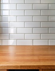 Glossy white subway tiles with an empty smooth wooden countertop