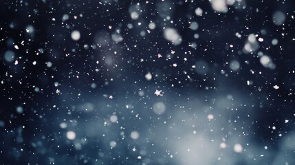 Fototapeta premium Falling Snowflakes in a Dark Winter Night Sky, Macro View.