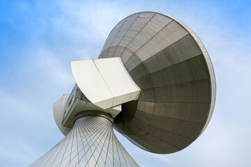 Large satellite dish parabola under blue sky