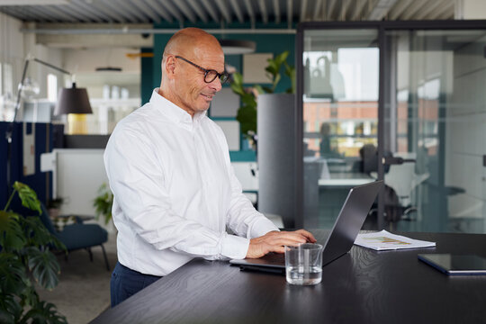 Businessman working on laptop at office