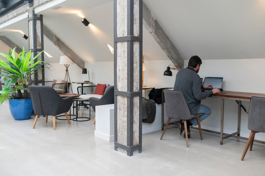 Man working on laptop in office