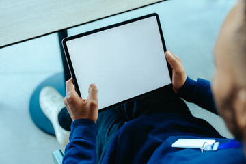 Person holding a tablet with empty copy space on the screen © Jacob Lund