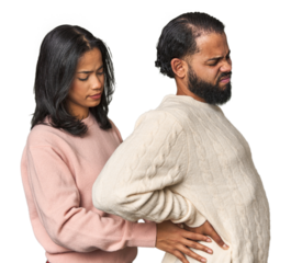 Young Latino couple in studio suffering a back pain.