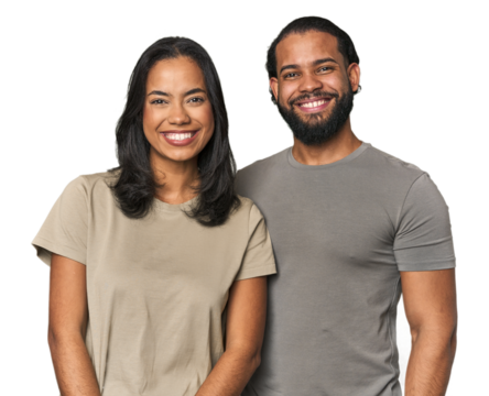 Young Latino couple in studio happy, smiling and cheerful.