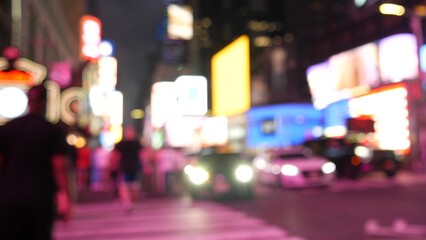 New York City Times Square Manhattan Midtown Broadway street, USA. American NYC urban life. Defocused people pedestrians, zebra crosswalk. Road traffic. Advertising signs, commercial billboard screens