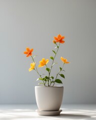 there is a potted plant with orange and yellow flowers in it