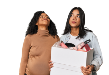 Latin women couple moving, one pregnant  dreaming of achieving goals and purposes