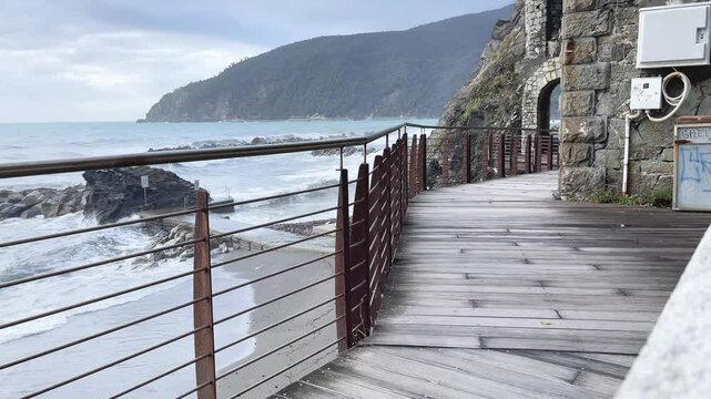 Old tower near sea in storm on mountain. Overcast weather, fog. Old building in Italy. Municipality Moneglia, Liguria region. 
