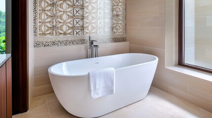 Elegant Freestanding Bathtub in Modern Bathroom with Chic Tiles