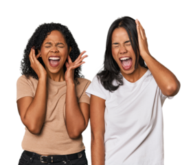 Young Latin friends in studio covering ears with hands trying not to hear too loud sound.