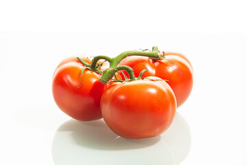 Food Concepts. Small Branch of Red Ripe Romatoes Placed Together Isolated