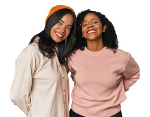 Young Latin friends together in studio happy, smiling and cheerful.