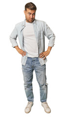Fototapeta premium Full body portrait of a man in studio confused, feels doubtful and unsure.