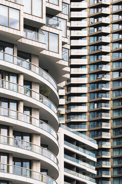 This image captures the distinctive geometric facades of modern residential buildings, showcasing contemporary architectural design and urban living elements.